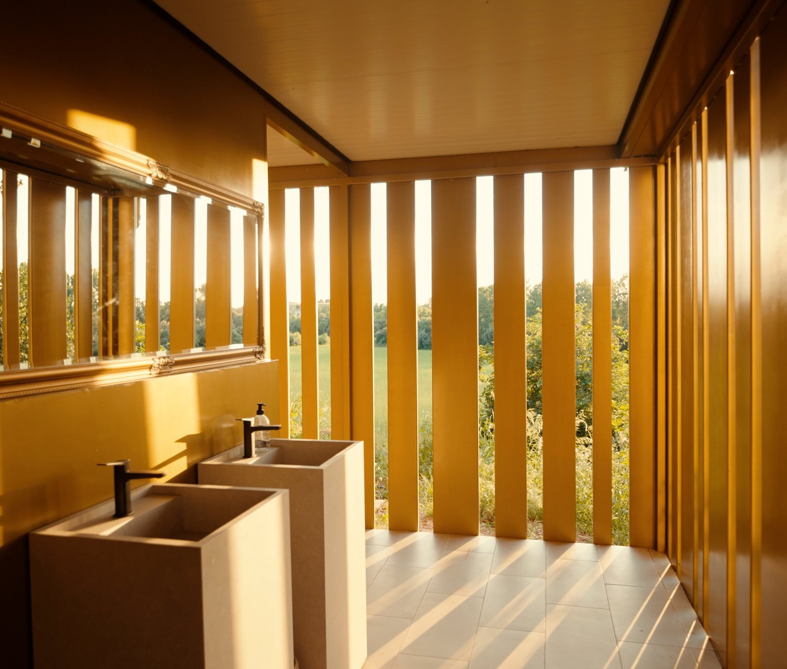 Interior corridor with warm light and timber slats, premium property on the Costa Brava